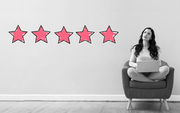 Five Star Rating with young woman using a laptop computer