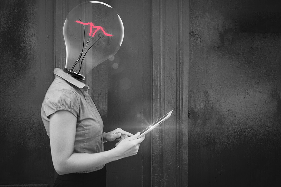 women with a lightbulb for a head, holding a tablet